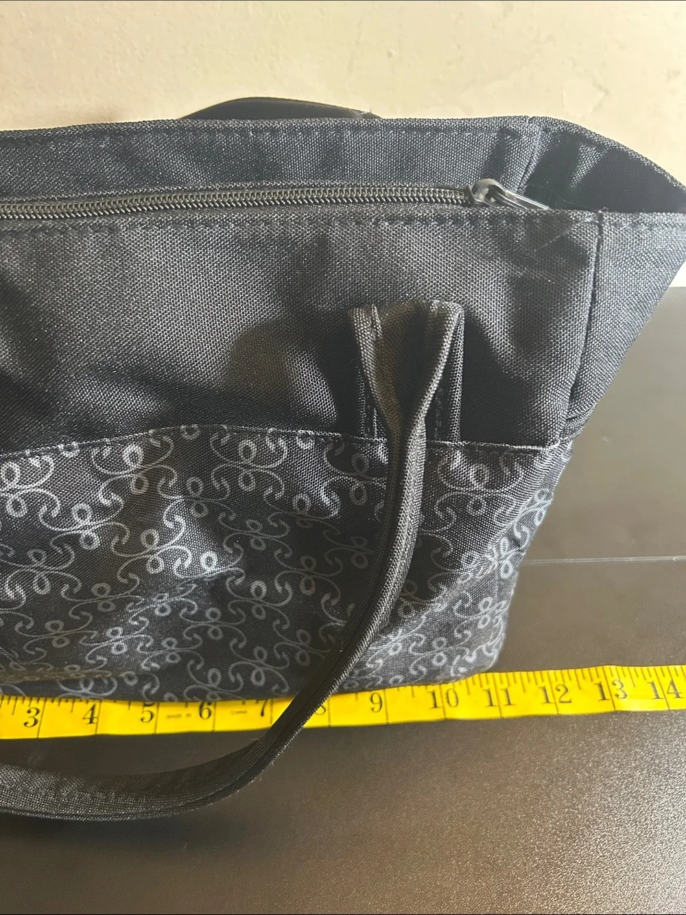 The First Years black and grey patterned canvas diaper bag tote